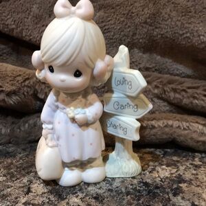 Precious moments porcelain figure.